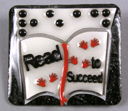 Photo of "Read to Succeed" braille pin