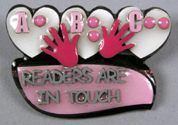 Photo of "Readers are in Touch" braille pin